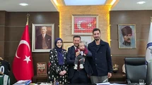 Başkanı Tatık makamında SMA hastası Kerem bebeği ağırladı