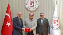 BŞEÜ’ye gümüş madalya ve madalya beratı takdimi