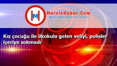 Kız çocuğu ile ilkokula gelen veliyi, polisler içeriye sokmadı