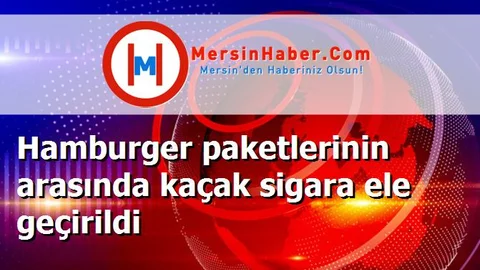 Hamburger paketlerinin arasında kaçak sigara ele geçirildi