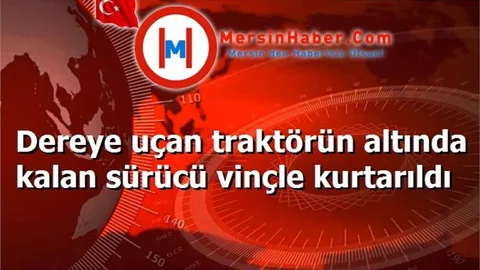 Dereye uçan traktörün altında kalan sürücü vinçle kurtarıldı
