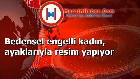 Bedensel engelli kadın, ayaklarıyla resim yapıyor