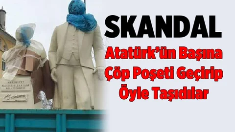 Atatürk heykelinin başına çöp poşeti sarıp taşıdılar