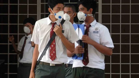 Malezya'da yaklaşık 6 bin öğrenci grip salgını yüzünden eğitime ara verildi