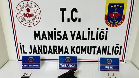 Salihli’de şüpheliden ruhsatsız tabanca ve mermi çıktı