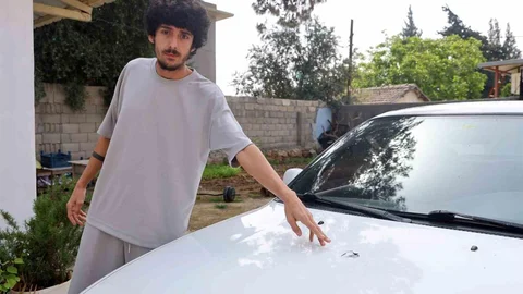 Sesle panik ve korku yaşayan vatandaşın aracına yorgun mermi isabet etti