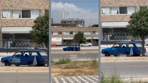 Mersin Sıcağı Bunu da Yaptırdı! Davultepe’de Sıcaktan Bunalan Sürücü Refüjdeki Ağacın Gölgesine Sığındı